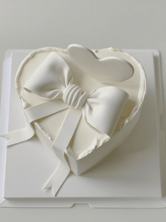 Minimalist White Bow Cake